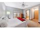 Bedroom with wood floors, ceiling fan, and large window at 4491 N 75 W, Franklin, IN 46184