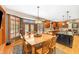 Inviting dining room featuring hardwood floors, designer lighting, and large windows offering natural light at 4491 N 75 W, Franklin, IN 46184