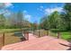 Lakeside wooden dock with railing, perfect for outdoor enjoyment at 4491 N 75 W, Franklin, IN 46184