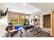 Basement home gym with treadmill, weight rack, and access to a full bathroom at 4491 N 75 W, Franklin, IN 46184