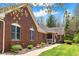 Beautiful brick home featuring manicured landscaping and a welcoming porch at 4491 N 75 W, Franklin, IN 46184