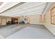 Spacious garage with painted floor, storage cabinets, an entrance and a ladder at 4491 N 75 W, Franklin, IN 46184