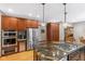 Open-concept kitchen featuring a gas range, stainless appliances, and ample cabinet storage at 4491 N 75 W, Franklin, IN 46184