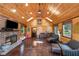 Cozy living room with wood paneling, fireplace, and comfortable seating at 4491 N 75 W, Franklin, IN 46184