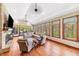 Open concept living room with a fireplace, hardwood floors, and lots of natural light at 4491 N 75 W, Franklin, IN 46184
