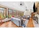 Bright living room with large windows, a stone fireplace, and comfortable seating at 4491 N 75 W, Franklin, IN 46184