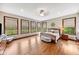 Airy main bedroom with large windows, neutral decor, and hardwood floors at 4491 N 75 W, Franklin, IN 46184