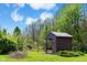 Rustic outbuilding nestled among lush greenery, with a small, well-maintained lawn at 4491 N 75 W, Franklin, IN 46184