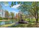 A lush pond with a dock amid verdant greenery and trees at 4491 N 75 W, Franklin, IN 46184