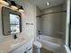 Updated bathroom featuring a tub and shower combination with a stylish vanity and modern fixtures at 457 Mariposa Trl, Carmel, IN 46032