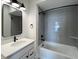 Modern bathroom showcasing updated fixtures, tiled shower, and a sleek vanity for a fresh aesthetic at 457 Mariposa Trl, Carmel, IN 46032