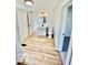 Updated bathroom with modern vanity, new flooring, and a stylish circular mirror at 607 S Pleasant St, Edinburgh, IN 46124
