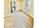 Cozy bedroom featuring neutral carpet, a bright window, and a closet at 607 S Pleasant St, Edinburgh, IN 46124
