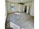 Spacious bedroom with plush carpeting, natural light, and ample closet space at 607 S Pleasant St, Edinburgh, IN 46124