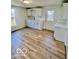 Efficient kitchen with white cabinets, updated countertops, and new vinyl flooring at 607 S Pleasant St, Edinburgh, IN 46124
