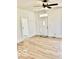 Bright living room featuring new floors, white trim, and a ceiling fan for comfort at 607 S Pleasant St, Edinburgh, IN 46124