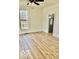 Inviting living room with modern flooring, neutral walls, and a large window for natural light at 607 S Pleasant St, Edinburgh, IN 46124