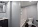 Updated bathroom features a modern vanity and shower-tub combination at 611 Della Rd, Columbus, IN 47203