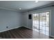 Bedroom with sleek flooring and sliding glass doors leading to the backyard at 611 Della Rd, Columbus, IN 47203