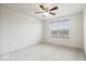 Bright bedroom featuring plush carpeting, a modern ceiling fan, and a window at 6724 Seattle Slew Dr, Whitestown, IN 46075