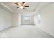 Generous main bedroom with tray ceilings, a ceiling fan, and plush carpeting at 6724 Seattle Slew Dr, Whitestown, IN 46075