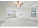 Spacious main bedroom with plush carpeting, tray ceilings, and lots of natural light at 6724 Seattle Slew Dr, Whitestown, IN 46075