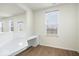 Bright home office space with built-in desk and plenty of natural light from the windows at 6724 Seattle Slew Dr, Whitestown, IN 46075