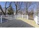 A lovely wooden backyard deck with white railings offers outdoor space at 7252 E 47Th St, Indianapolis, IN 46226