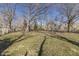 The yard features grass, several trees, and a fire pit at 7252 E 47Th St, Indianapolis, IN 46226