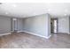 Open living area with gray walls and modern flooring, showcasing the entrance at 7252 E 47Th St, Indianapolis, IN 46226