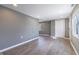 View of the living area with updated flooring, gray walls, and a closet at 7252 E 47Th St, Indianapolis, IN 46226