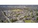 Aerial view showing a beautiful neighborhood with mature trees in close proximity to a school at 7943 Beaumont Green East Dr, Indianapolis, IN 46250