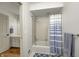 Clean bathroom features a shower-tub combo with a blue and white striped curtain at 7943 Beaumont Green East Dr, Indianapolis, IN 46250