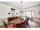Formal dining room with chandelier, hardwood floors, and a large dining table at 7943 Beaumont Green East Dr, Indianapolis, IN 46250