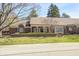 Charming brick home with a covered porch and well-maintained landscaping at 7943 Beaumont Green East Dr, Indianapolis, IN 46250