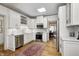 Bright kitchen features stainless steel appliances, marble countertops, and a traditional rug at 7943 Beaumont Green East Dr, Indianapolis, IN 46250