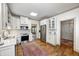Spacious kitchen with stainless appliances, white cabinetry, and an adjacent breakfast nook at 7943 Beaumont Green East Dr, Indianapolis, IN 46250
