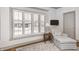 Comfortable reading nook features natural light from window with privacy shutters and accent chair at 7943 Beaumont Green East Dr, Indianapolis, IN 46250