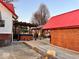 Backyard featuring a hot tub, patio area, outdoor kitchen, and a brick outbuilding at 8089 W Old State Road 67, Paragon, IN 46166