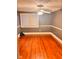 Bedroom with hardwood floors, a ceiling fan, and a window at 8089 W Old State Road 67, Paragon, IN 46166