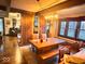 Dining room with wooden table and bench seating with a view to the living area at 8089 W Old State Road 67, Paragon, IN 46166