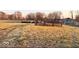 Expansive pasture land with fencing, hay bales, and a barn, perfect for agricultural endeavors at 8089 W Old State Road 67, Paragon, IN 46166