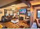 Comfortable living room features stone fireplace and decorative ceiling beams at 8089 W Old State Road 67, Paragon, IN 46166