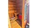A wood-lined sauna room with bench seating and a red heater at 8089 W Old State Road 67, Paragon, IN 46166