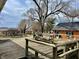 Wooden deck with seating and grill overlooking the backyard and detached garage at 810 S 400 W, Bargersville, IN 46106