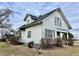 Classic two-story home with white siding, dormer windows, and a traditional architectural style on a partially cloudy day at 810 S 400 W, Bargersville, IN 46106