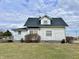 Side view of a two-story home with a charming exterior and landscaped yard at 810 S 400 W, Bargersville, IN 46106
