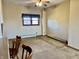Bright living room features a ceiling fan and a large window, enhancing the room's appeal at 810 S 400 W, Bargersville, IN 46106