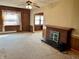 Bright living room featuring a brick fireplace, enhancing the room's appeal at 810 S 400 W, Bargersville, IN 46106