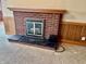 Living room boasting a brick fireplace with black trim, adding character and warmth to the space at 810 S 400 W, Bargersville, IN 46106